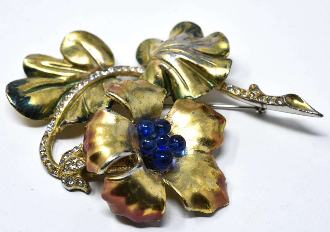 C 1935 Unsigned Boucher 3D Floral Brooch / Pin: C 1935 Unsigned Boucher 3D Floral Brooch / Pin. Possibly unsigned Marcel Boucher retro floral pin with gilt enamel and blue glass bead stamens, clear paste accents on stem. Measures 3 1/4 inches.