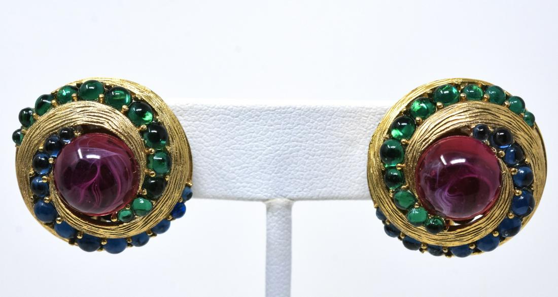 Pair C 1970 Trifari Mughol Design Clip Earrings: Pair C 1970 Trifari Mughol Design Clip Earrings. With gemstone cabochons in a swirl design gilt setting. Signed Trifari on back. Measures 1 inch in diameter.