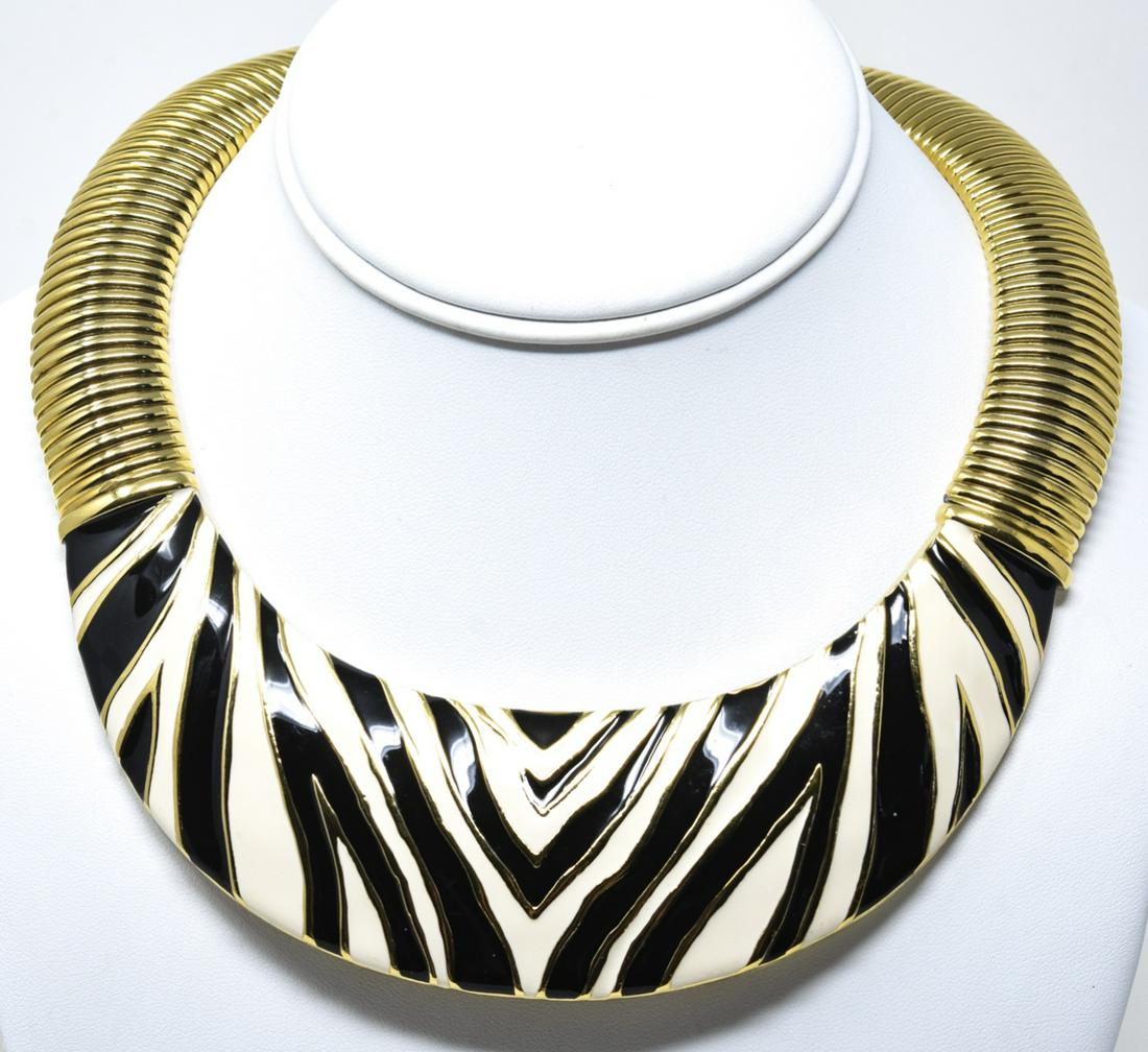 Givenchy Enamel Zebra Motif Collar Necklace: Givenchy Enamel Zebra Motif Collar Necklace. Gilt wide collar necklace with enameled zebra panel with flat gashose chain. Signed on back panel. Measures 1 1/2 inches wide and approximately 14 inches i
