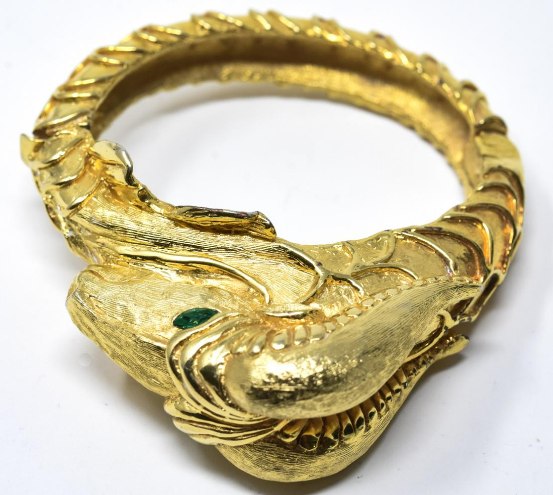 C 1975 Rare Unsigned KJL Capricorn Bangle Bracelet: C 1975 Rare Unsigned KJL Capricorn Bangle Bracelet Motif of rams head with fish scale body, Capricorn design. With marquise green eyes. Measures 2.25 inches across the interior opening.