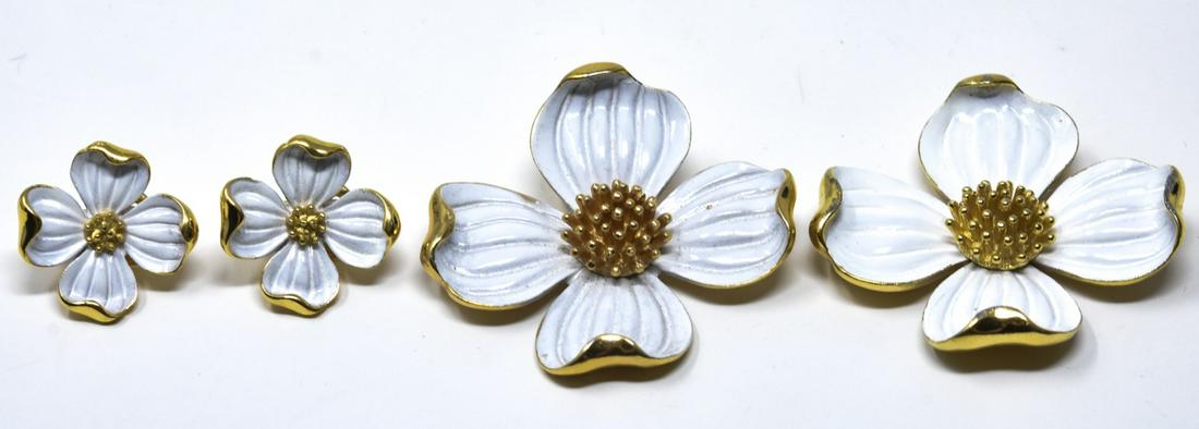 Crown Trifari C 1970 Gilt Enamel Brooch & Earrings: Crown Trifari C 1970 Gilt Enamel Brooch & Earrings. Gilt with white enamel dogwood flower design. Two brooches measure nearly 2 inches in width.