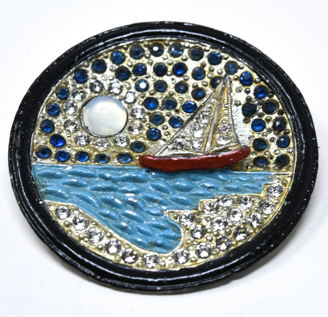 C 1930 Moon Over Miami Enamel Brooch / Pin: C 1930 Moon Over Miami Enamel Brooch / Pin. Featuring enamel and paste with moonstone cabochon. Sailboat under moon motif. Measures 1 7/8 inches round.