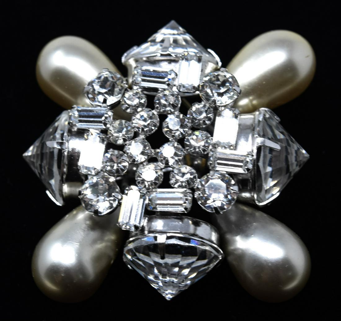 Schreiner NY Clear Paste Crystal Pearl Brooch: Schreiner NY Clear Paste Crystal Pearl Brooch. Round and emerald cut paste cluster framed by tear shaped pearls and reverse set clear crystals. All prong set. Measures 2 1/8 inches square. Signed on b