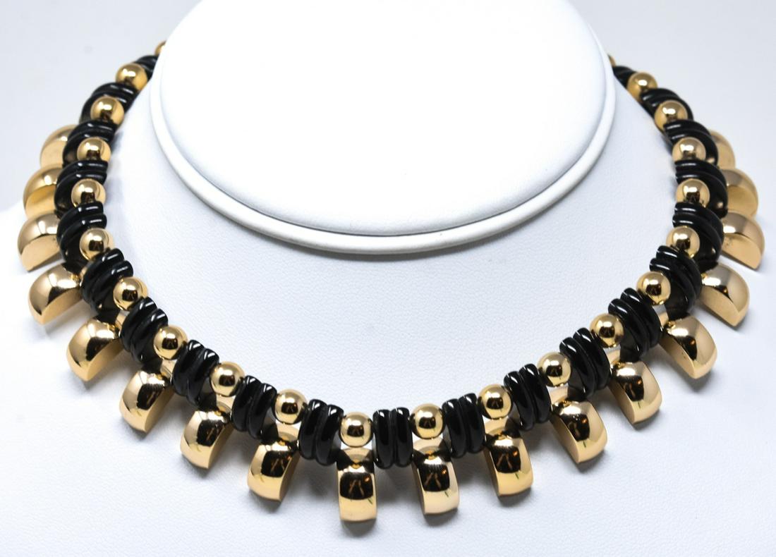 Vintage De Farre Carved Bakelite & Gilt Necklace: Vintage De Farre Carved Bakelite & Gilt Necklace. Signed. Carved bakelite and gilt over aluminum. Demi lune carved beads. Measures 14 inches in length.
