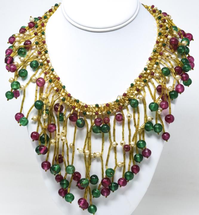 Vintage C 1960s Italian Art Glass Bib Necklace: Vintage C 1960s Italian Art Glass Bib Necklace. Handmade using art glass beads in gold, clear, ruby and emerald tones. Faux pearl accents. Measures 18 inches in length.