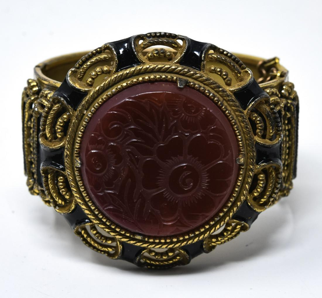 Antique C 1930s Carved Carnelian & Gilt Bracelet: Antique C 1930s Carved Carnelian Pate de Verre & Gilt Bracelet w Enamel Decoration. Hinged bangle bracelet with safety chain. Measures nearly 2.5 inches across interior opening.
