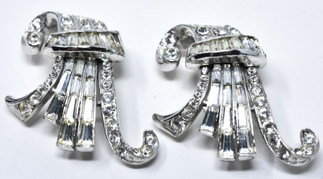 Pair of Vintage Coro Craft Rhodium Plated Clips: Pair of Vintage Coro Craft Rhodium Plated Clips / Brooches. Signed. Rhinestone set. Each measures 1.25 inches in length.