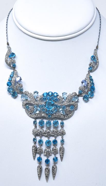 Czech C 1915 Edwardian Blue Paste Necklace: Czech C 1915 Edwardian Blue Paste Necklace. Czechchoslovakian necklace with light and bright blue paste in scrolls, florals, and teardrops accented by clear paste. Measures 16 inches.