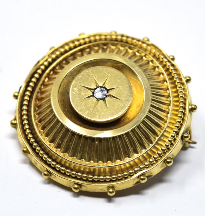 Victorian 14k Gold & Diamond Mourning Brooch: Victorian 14k Gold & Diamond Mourning Brooch. 14k yellow gold brooch with center diamond and glass locket on reverse. Measures 1 3/8 inches.