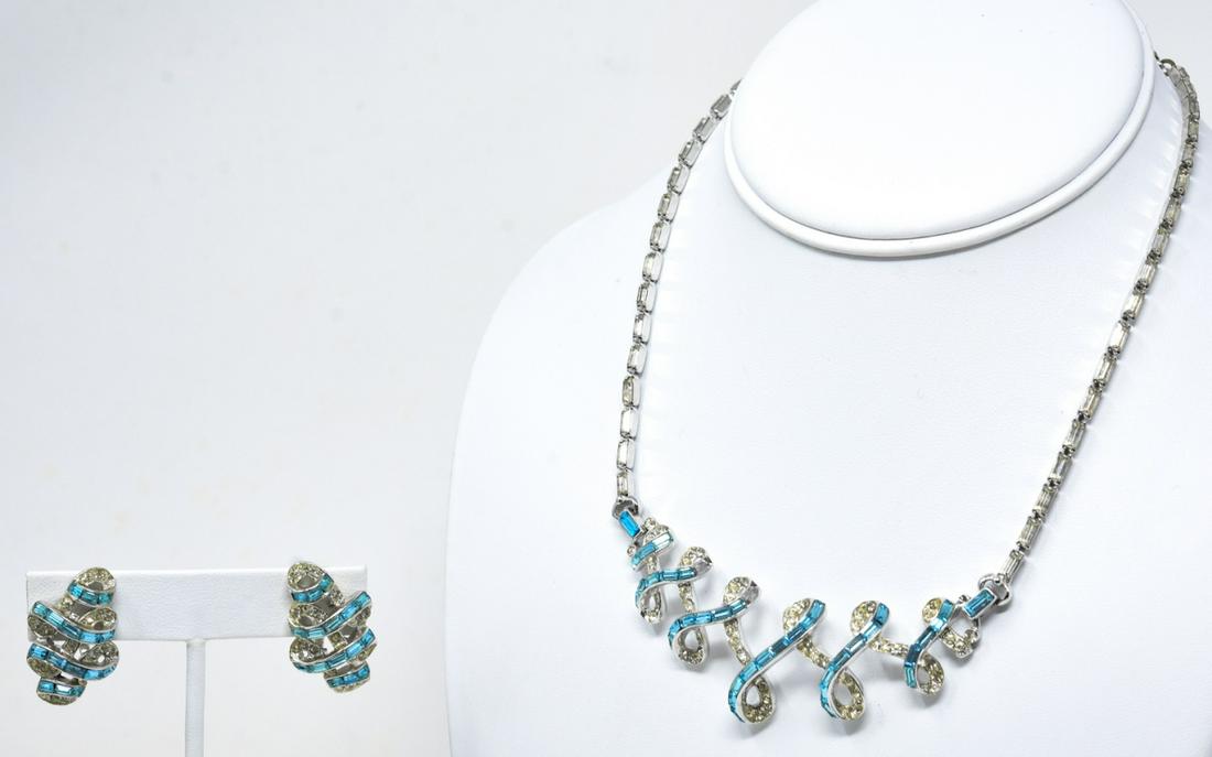 C 1950 Coro Craft Aqua Paste Necklace & Earrings: C 1950 Coro Craft Aqua Paste Necklace & Earrings. Rhodium with aqua and clear paste loopy design necklace and clip earrings by Coro Craft. Signed. Necklace measures 17 inches.