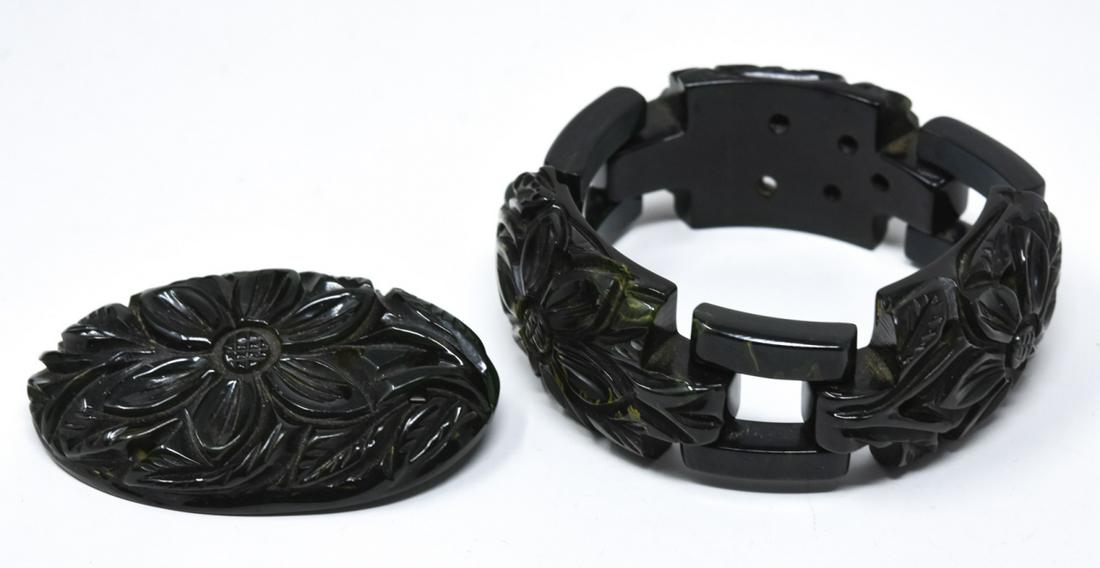 C 1940 Carved Green Bakelite Bracelet & Pin: C 1940 Carved Green Bakelite Bracelet & Pin. Bracelet and pin in dark green bakelite floral motif. Bracelet measures 7 inches pin measures 2.5 inches.