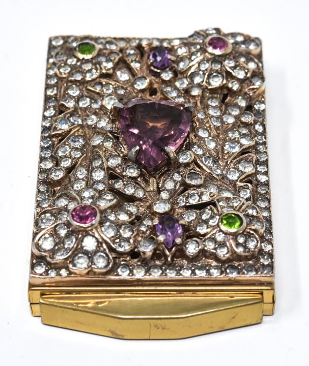 Hobe Style Paste Jewel Encrusted Ladies Compact: Hobe Style Paste Jewel Encrusted Ladies Compact. With paste jewel encrusted flower design and center amethyst past heart. Measures 3 inches x 2 inches.