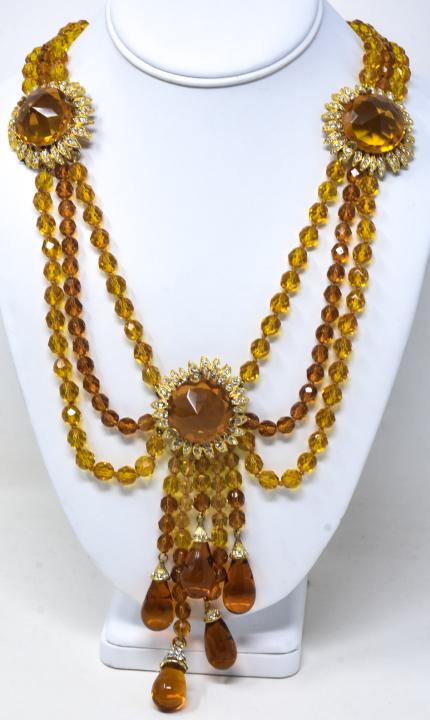 Vintage Costume Jewelry Citrine Glass Necklace: Ornate & Well Made Vintage Costume Jewelry Citrine Glass Necklace w Clear Rhinestones. Triple strand necklace with sun flower motif sections, pendant and tear drop tassels. French wrapped, hand knotte