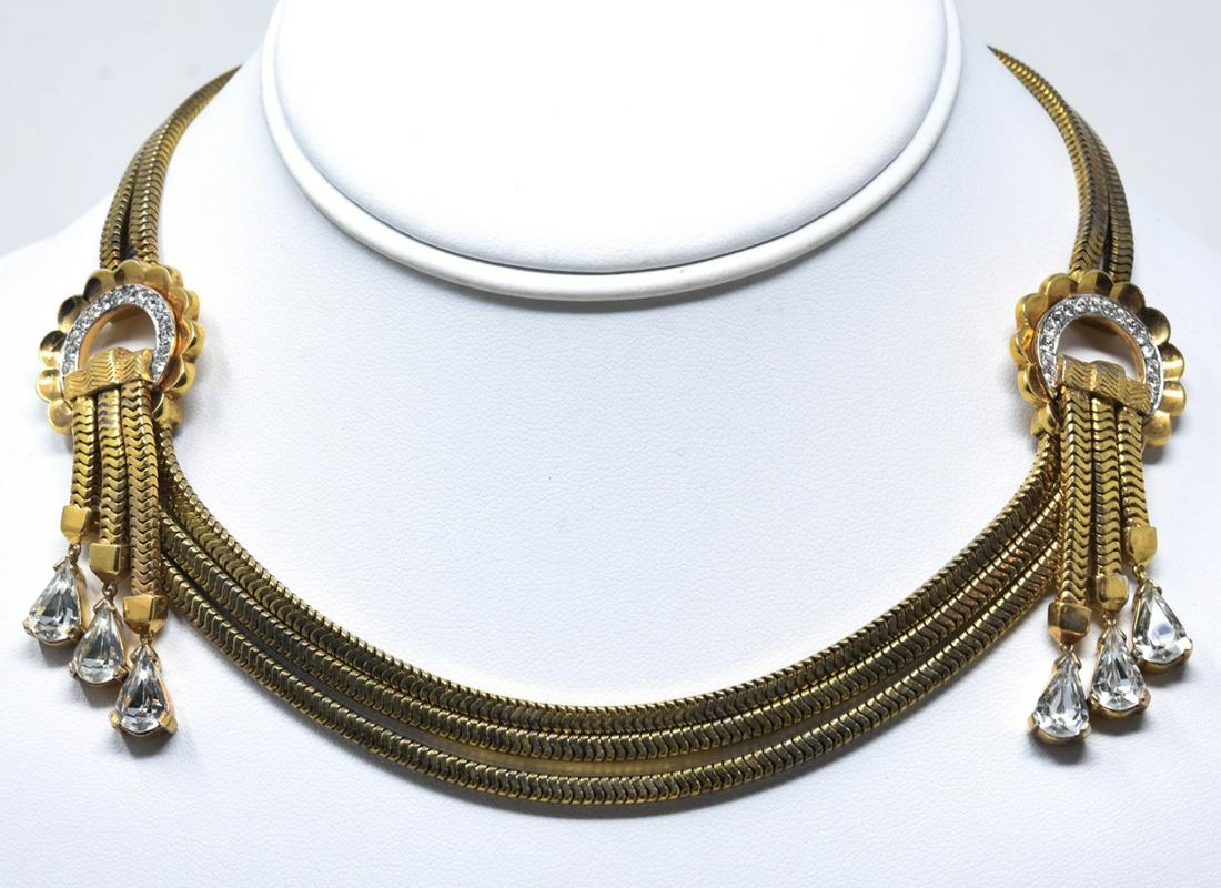 Unsigned Mazer Bold Retro Gilt Necklace: Unsigned Mazer Bold Retro Gilt Necklace. Gilt snake chain suspending 3 strand swag with scalloped hoop stations and pear shape end fringe. Measures 15 1/4 inches.