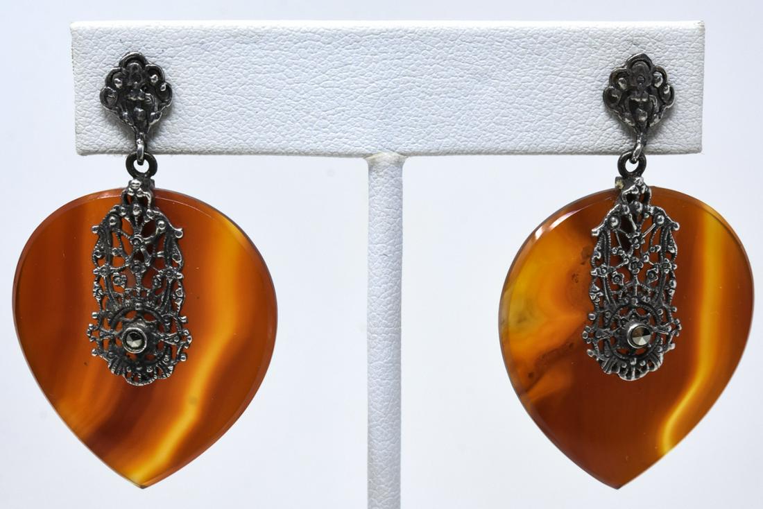 Pair of Carved Agate Sterling & Marcasite Earrings: Pair of Vintage Carved Agate Sterling Silver Filigree & Marcasite Earrings. Each measures nearly 2 inches in length. Hallmarked.