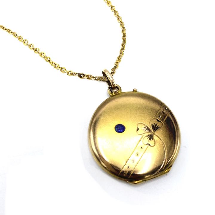 Victorian Gold Filled Clover & Sapphire Locket: Victorian Gold Filled Clover and Sapphire Locket – Hangs from a vintage 17 inch chain. Locket is approximately 1 inch in diameter and opens and snaps shut securely.