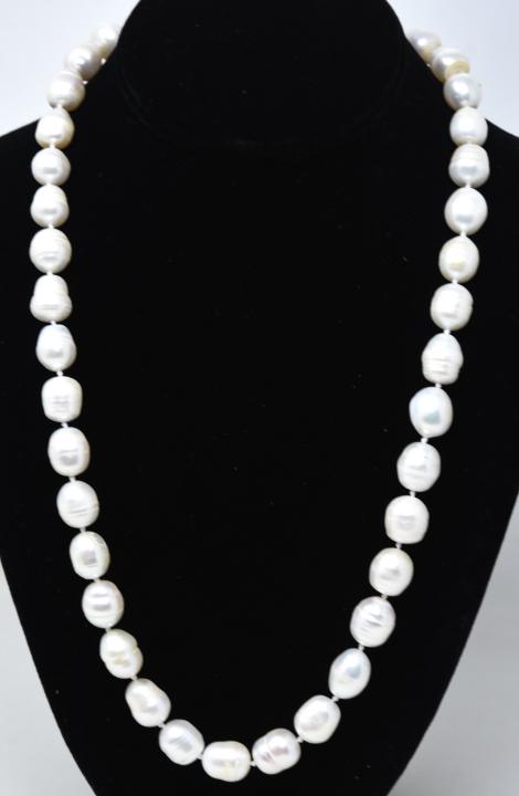 Hand Knotted Large Baroque Pearl Necklace Strand: Hand Knotted Large Baroque Pearl Necklace Strand. Pearls are approximately 8 to 12 mm in length. Necklace measures 24 inches in length.