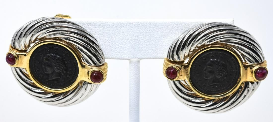 Pair of Vintage Costume Jewelry Faux Coin Earrings: Pair of Vintage Costume Jewelry Faux Coin Earrings. Clip ons. Ruby paste cabochons accents. Each measures 1.25 inches in length.