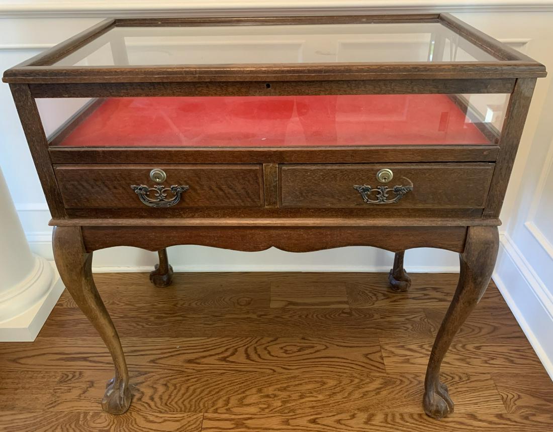 Claw Foot Glass Display Table: Claw Foot Glass Display Table. Display table with glass top and cabriole legs with claw feet. Measures 35 inches x 34 inches x 20.5 inches.