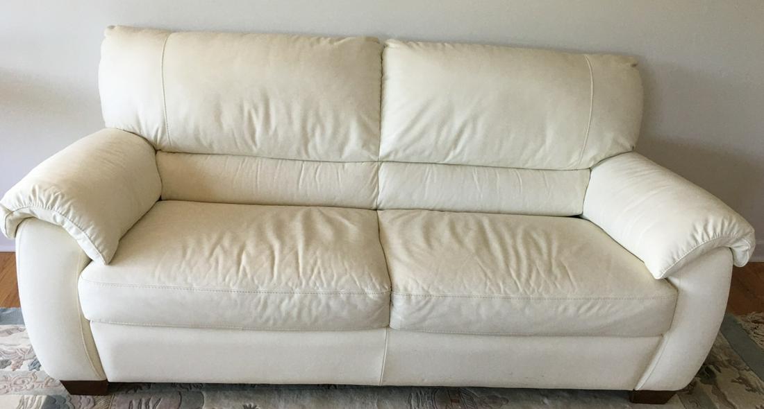 Contemporary White Leather Sofa / Couch: Contemporary White Leather Sofa / Couch. Measures 36 inches x 79 inches x 34 inches.