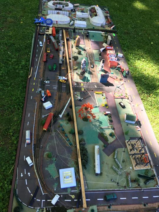 Vintage Model Train Set: Vintage Model Train Set. Hand assembled model train set with two panels. buildings and accessories. Measures 133 inches x 49 inches, 94 inches x 50 inches.