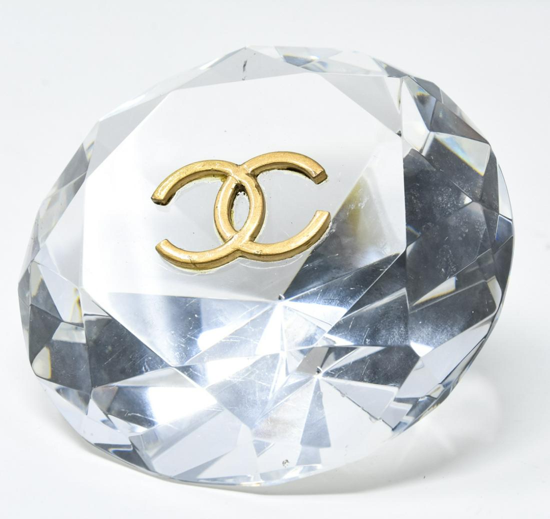 Large Chanel Style Faceted Crystal Paperweight: Large Chanel Style Faceted Crystal Paperweight. Crystal diamond form paperweight with a double C logo. Measures 2.5 inches x 5 inches.