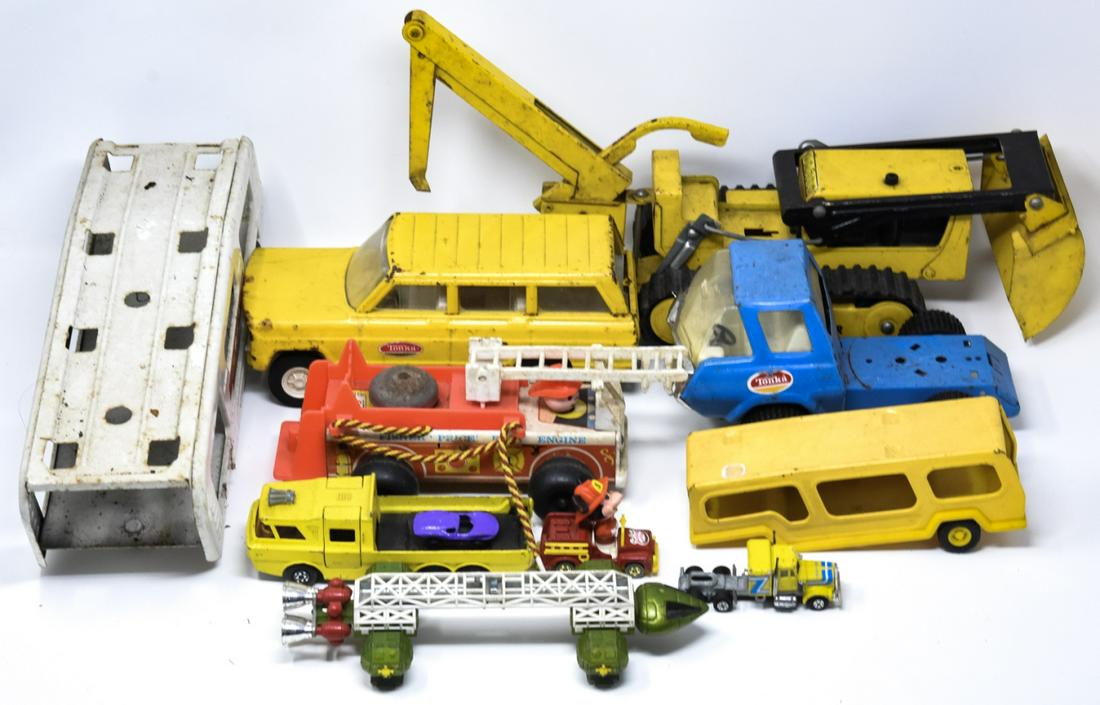Lot of Vintage Toys Incl Tonka Trucks: Lot of Vintage Toys Incl Tonka Trucks. Lot of vintage toys including Tonka trucks. Trencher measures approximately 6 inches x 12 inches x 5 inches.