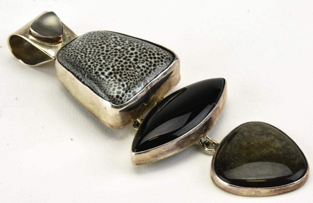 Amy Kahn Russell Sterling Silver Necklace Pendant: Amy Kahn Russell Sterling Silver Necklace Pendant. Set with four cabochons. Signed / hallmarked on back. Measures 4 inches in length.