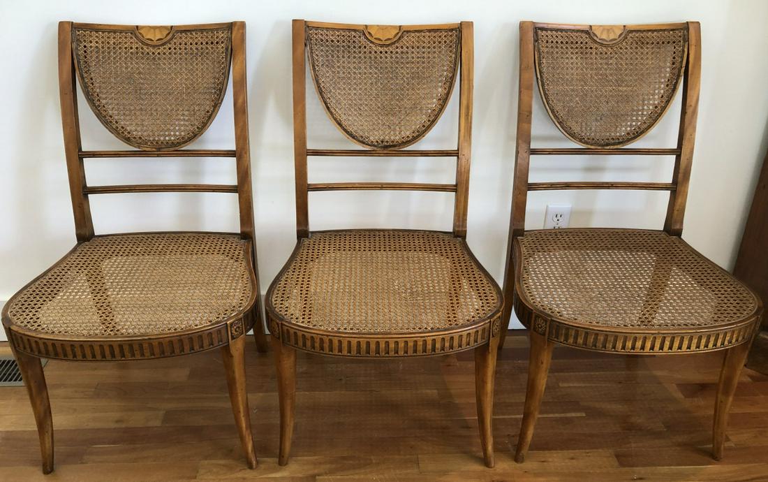Alfonso Marina Carved Caned Regency Dining Chairs: Alfonso Marina Carved Caned Regency Dining Chairs. 3 chairs with Caned backs and seats, marquetry medallion pattern on chair back. Carved detail and medallions on chair legs.