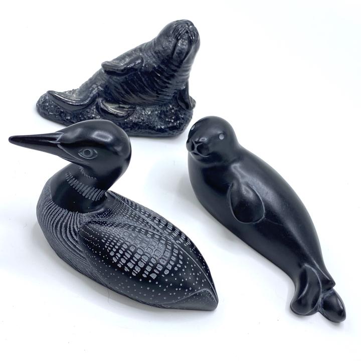 Trio of Black BOMA AARDIK Carvings: Trio of Black BOMA AARDIK Carvings –These handmade black soapstone carvings are from Canada and are signed. They depict a seal, walrus and duck. For scale the duck is about 4 x 2.5 inches.