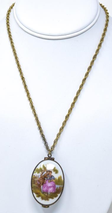 Antique Limoges Locket on Gold-Filled Chain: Antique Limoges Locket on Gold-Filled Chain. Fully Hallmarked. Scene on the porcelain is slightly different from front to back but both sides depict a young couple in period dress. Locket is approxima
