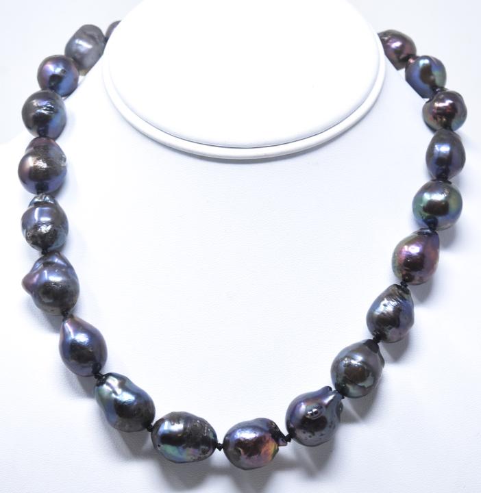Tahitian Black Cultured Baroque Pearl Necklace: Hand Knotted Tahitian Black Cultured Baroque Pearl Necklace Strand. Hand knotted on black silk thread. Pearls are graduated in size. Cultured pearls from Ha Long Bay area of Vietnam. Largest pearl mea