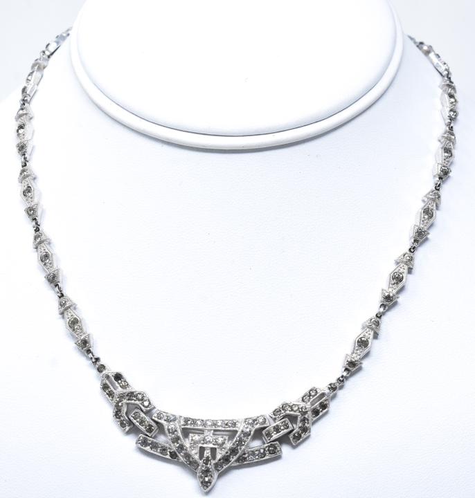 Antique Art Deco Rhodium Plate Rhinestone Necklace: Antique Art Deco Rhodium Plate Rhinestone Necklace. Measures 16 inches in length.