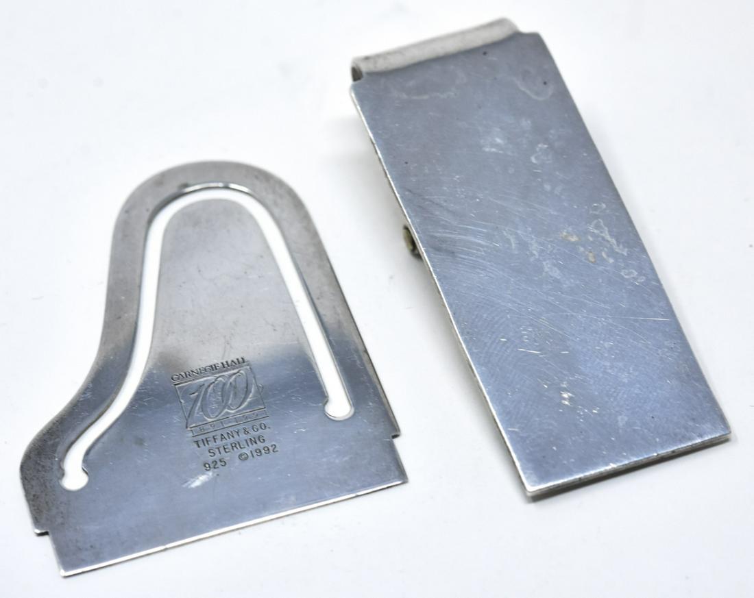 Pair of Sterling Silver Money Clips Incl Tiffany: Pair of Sterling Money Clips Incl Tiffany. One Sterling Money clip probably Mexican and signed 925. The other is in the form of a piano and appears to be commemorative and signed Tiffany and Carnegie
