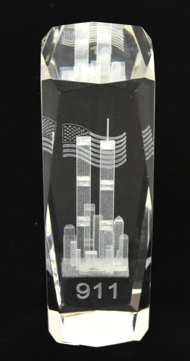9/11Crystal Memorial Glass in Glass Sculpture: 9/11Crystal Memorial Glass in Glass Sculpture featuring Twin Towers, American Flag. 6 inches x 2.5 inches in diameter.