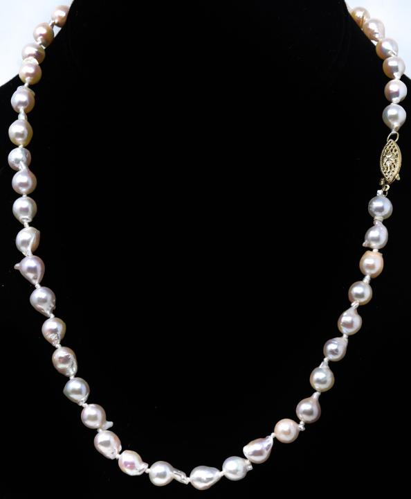 Vintage Baroque Pearl Necklace w 14k Gold Clasp: Vintage Baroque Pearl Necklace with 14k Gold Clasp – Approximately 18 inches long with pearls that are about 7-7.5mm. Appears to be dead stock. Provenance: From a prominent Westchester Jewelry S