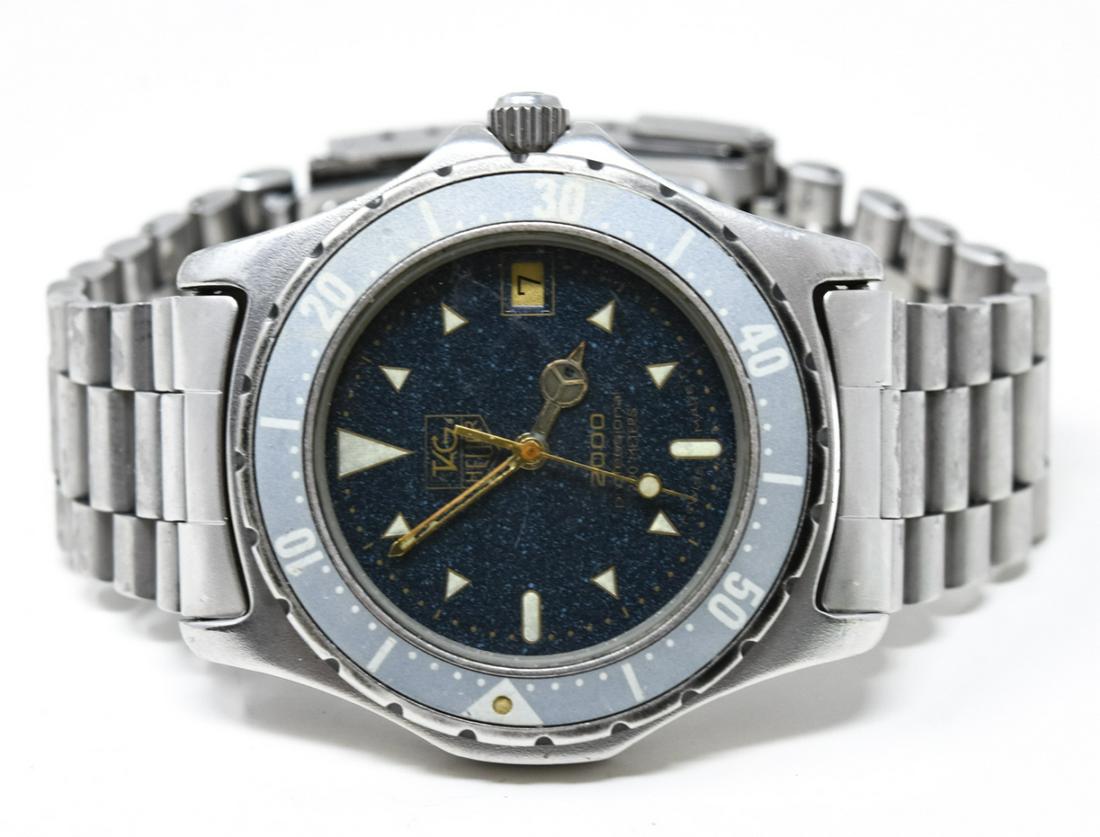 Vintage Tag Hauer 2000 Men’s Watch: Vintage Tag Hauer 2000 Men’s Watch – Authentic Swiss made Tag Hauer 2000 professional watch with navy face which is approximately 1.5 inches in diameter. Provenance: From a prominent Westc