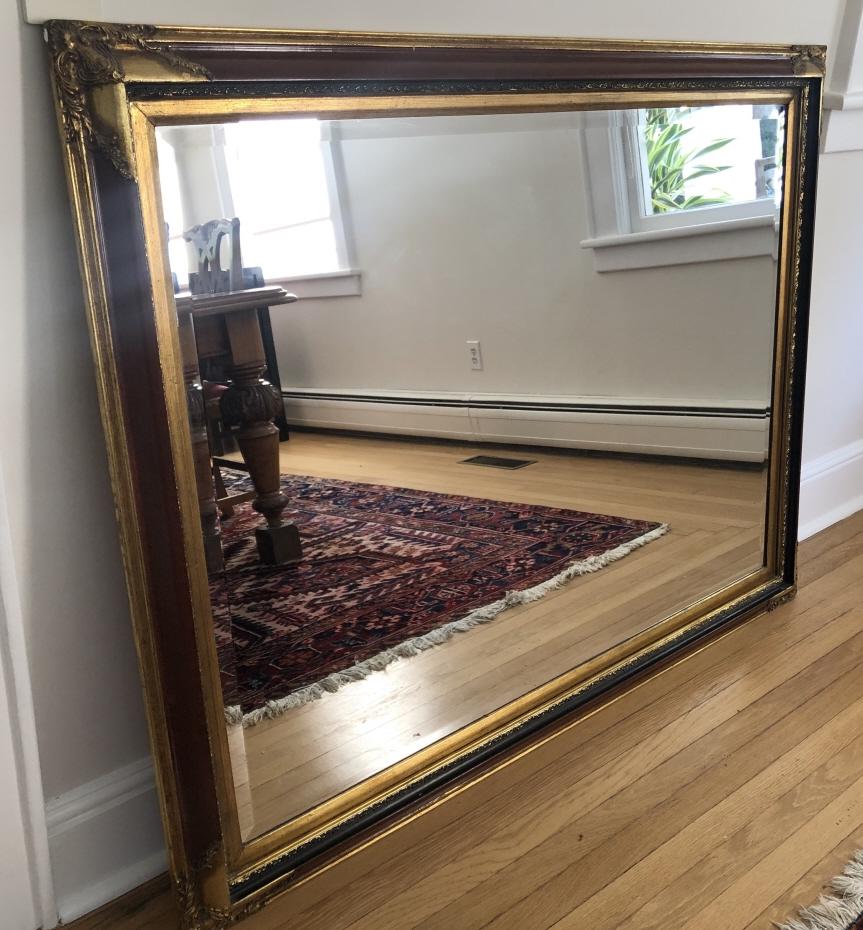 French Empire Gilt & Ebony Carved Hall Mirror: French Empire Gilt & Ebony Carved Hall Mirror. 56 inches x 44 inches