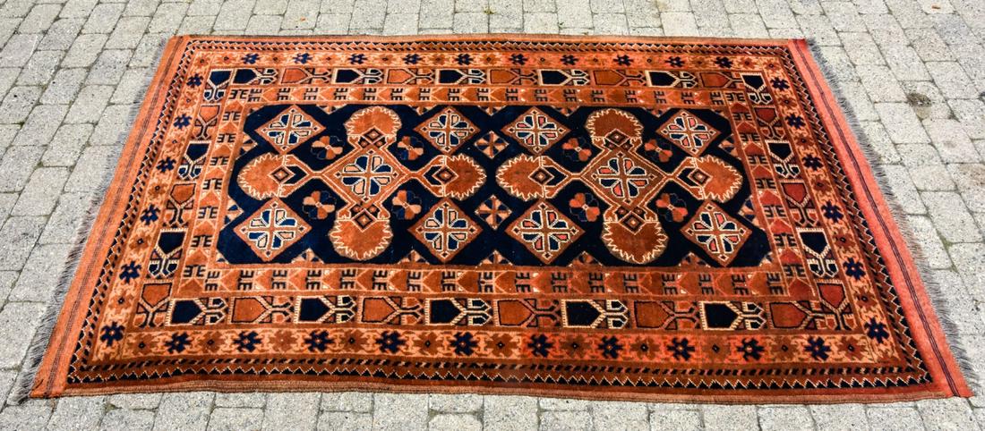 Antique Hand Knotted Wool Oriental Persian Carpet: Antique Hand Knotted Wool Oriental Persian Carpet. Tones of blue, orange, red, beige. Fringe ends. Measures 75 x 48 inches.