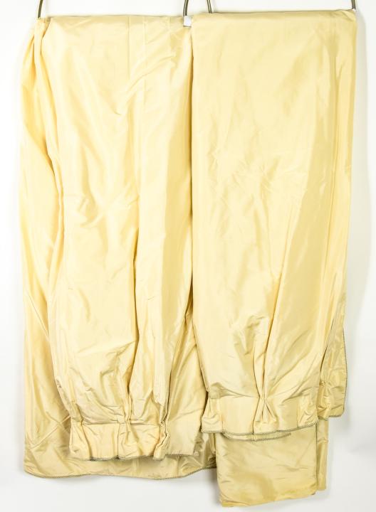 Pair Custom Made Ivory Tone Quality Silk Curtains: Pair of Custom Made Ivory Tone Quality Silk Curtains. High quality silk fabric fronts, with both black out and secondary muslin linings. Pleated tops and silk cord borders. Each measures approximately