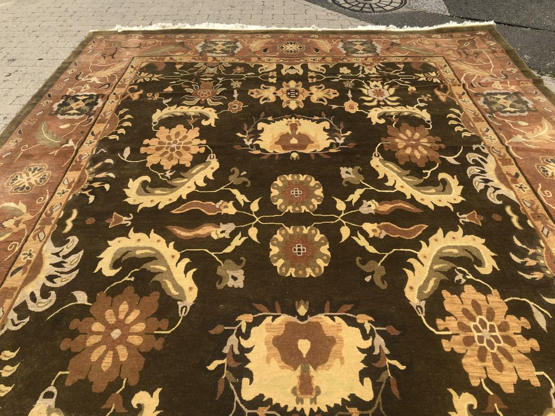 Hand Knotted Nepal Oriental Wool Carpet 10 x 13: Hand Knotted Made in Nepal Oriental Wool Carpet Brown 10 x 13 with Feather Motif. Brown, rust, gold and ivory color ways. 9 feet 11 inches x 13 feet 7 inches.