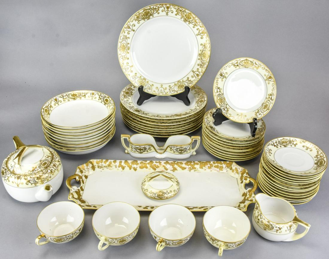 Antique Noritake Gold Lear Porcelain Plate Service: Antique Noritake Gold Leaf Porcelain Plate Service. Made in Japan, hand painted partial plate service includes 9 dinner plates, 11 salad plates, 9 soup, 12 saucers, 4 tea cups, tea pot, creamer, spoon