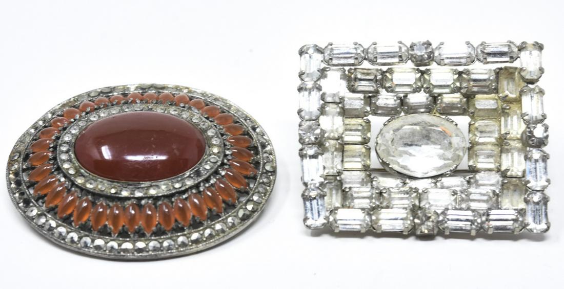 Two Vintage Rhinestone & Carnelian Brooch Pins: Two Vintage Rhinestone Costume Jewelry / Art Deco Brooch Pins. One with clear rhinestones and one with marcasite / carnelian. Rhinestone measures 1.75 inches in width.