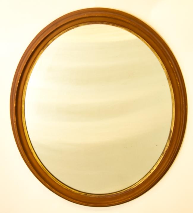 Antique Oval Form Wood & Gilt Wood Wall Mirror: Antique Oval Form Wood & Gilt Wood Wall Mirror. Measures 27 x 23.5 inches.