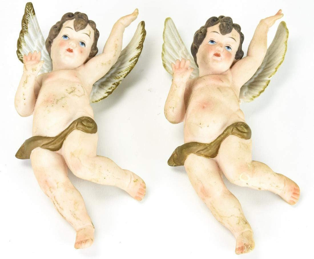 Pair Nippon Porcelain Figural Putti / Angels: Pair Nippon Porcelain Figural Putti / Angels. Hand painted porcelain putti to display on a wall. Each measures 6.5 inches x 3.5 inches.