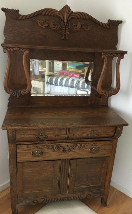 Victorian Carved & Mirrored Sideboard: Victorian Carved & Mirrored Sideboard. Victorian sideboard with carved details, mirror, pull-out drawers and lower cabinet. Measures 71 inches x 40 inches x 19 inches.