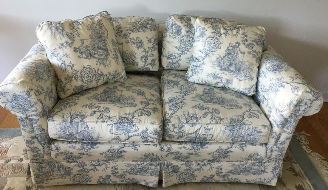 Pennsylvania House Toile Upholstered Love Seat: Pennsylvania House Toile Upholstered Love Seat. With blue and white toile fabric upholstery. Measures 26 inches x 61 inches x 36 inches.