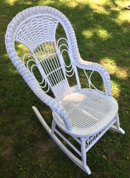 White Wicker Rocking Arm Chair: White Wicker Rocking Arm Chair. Measures 36 inches x 21 inches x 31 inches.