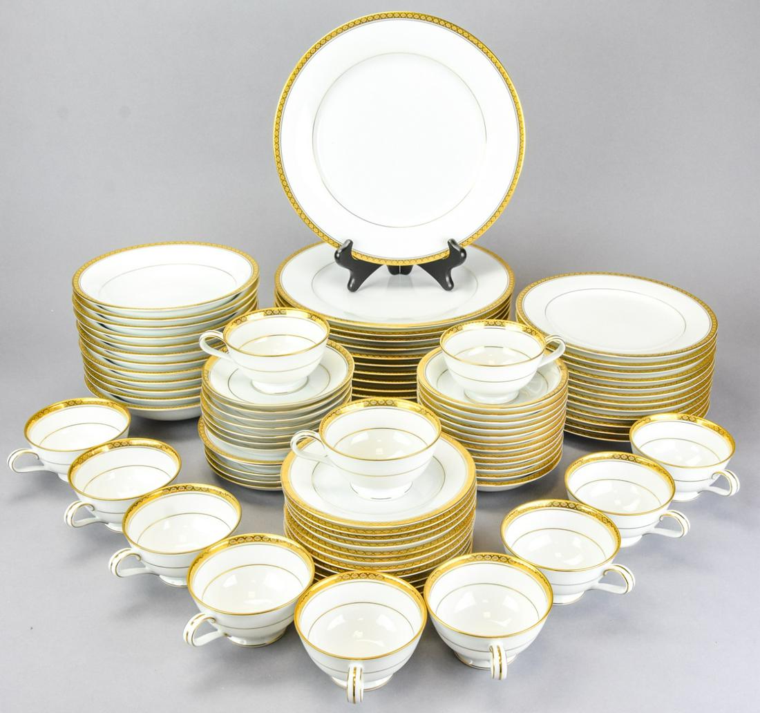 Noritake Japan Richmond Porcelain Service for 12: Noritake Japan Richmond Porcelain Service for 12. White bone china with gold ribbon rim. Includes 12 dinner plates, lunch plates, salad plates, soup bowls, fruit bowls, coffee cups and saucers. Dinner