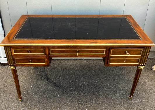 French Louis XVI / Maison Jansen Leather Top Desk: French Louis XVI / Maison Jansen Leather Top Desk. Mahogany tone wood with gilt trim. Measures 28.5 x 49.5 x 27 inches. Property of a designer decorated Manhattan, New York penthouse apartment.
